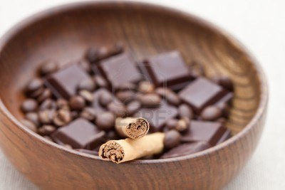 7828219-cinnamon-sticks-with-chocolate-and-coffee-beans-in-a-wooden-bowl-shallow-dof